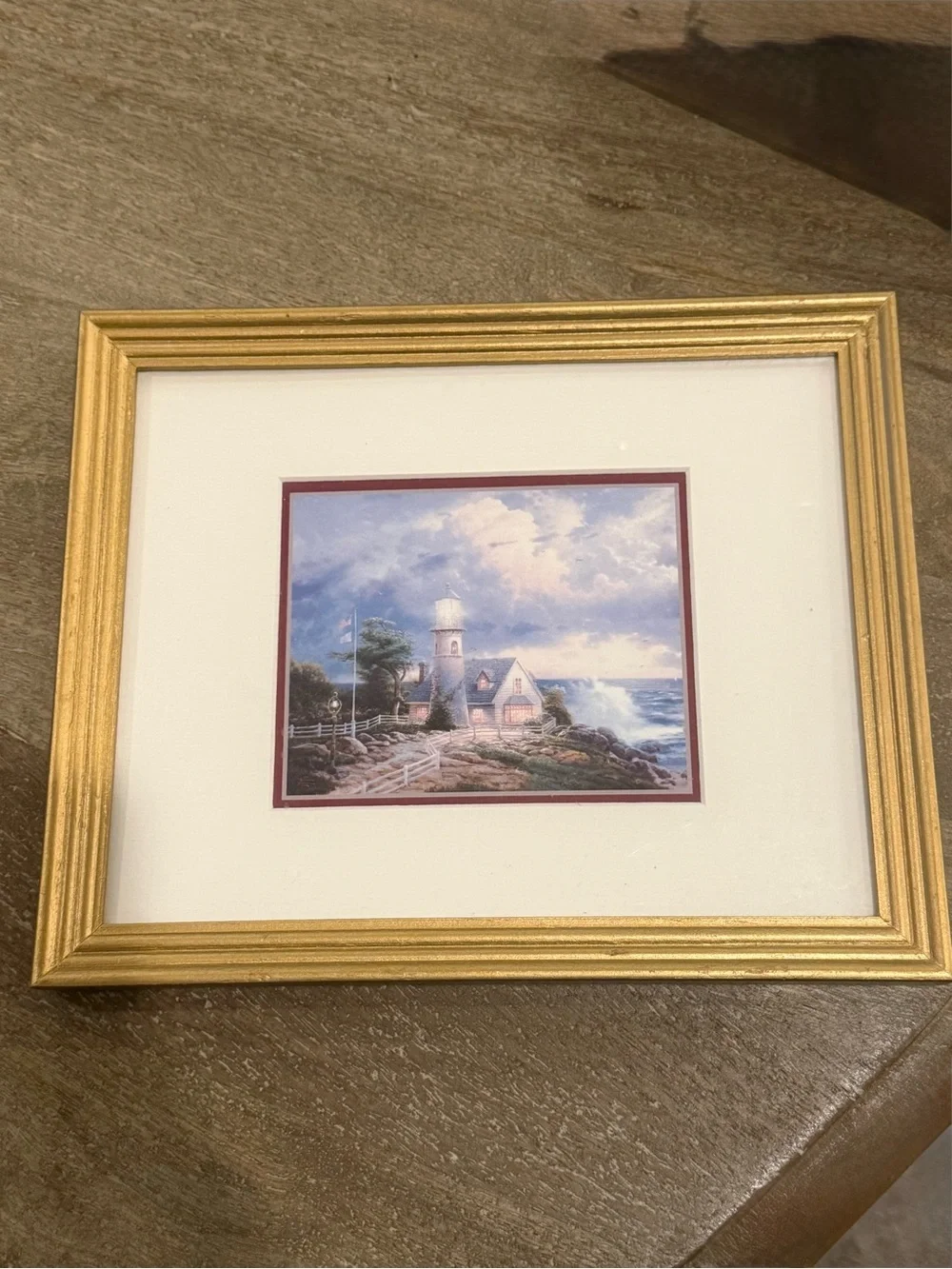 Thomas Kinkade Gold Framed Lighthouse Print with Blue Sky and White Clouds